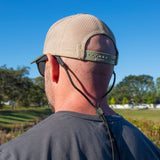Mean wearing Fuse Sunglass Cord Grip looking out into greenery